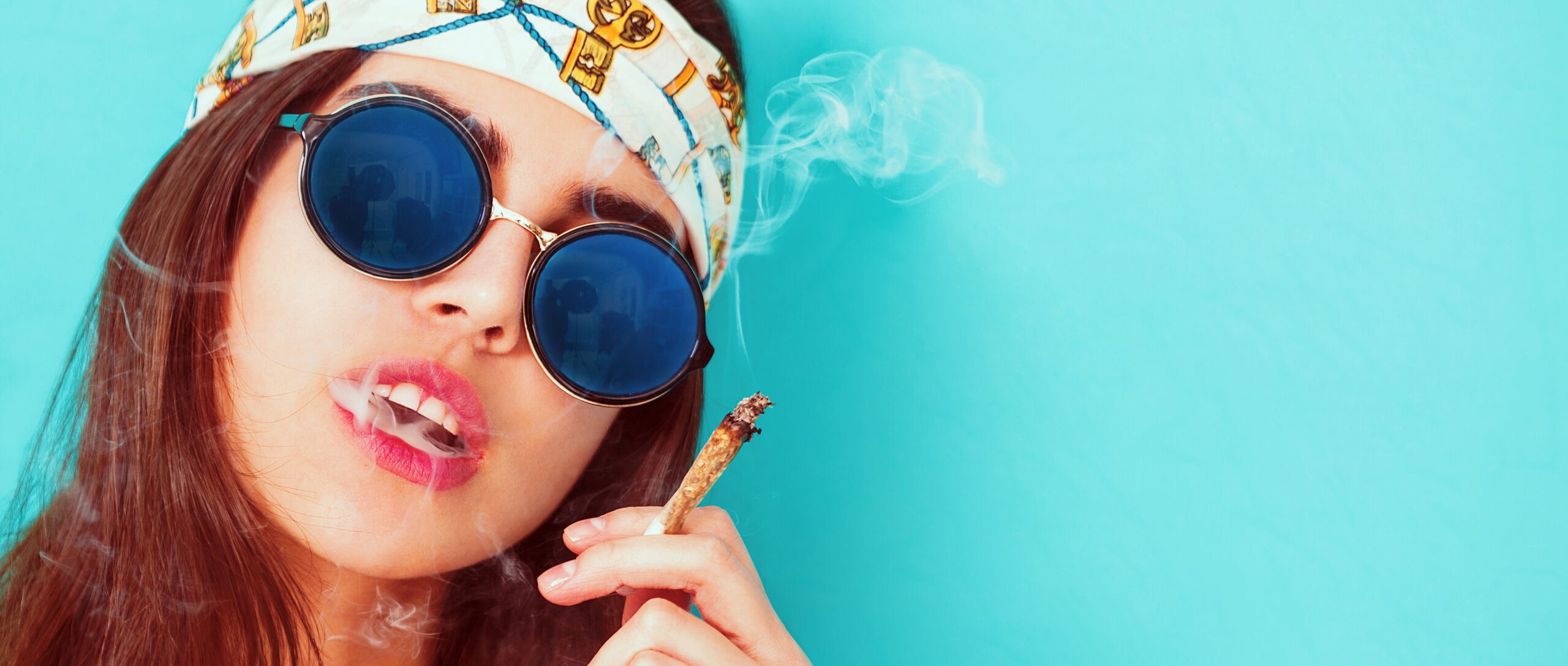 Hippie girl portrait smoking and wearing sunglasses letterbox